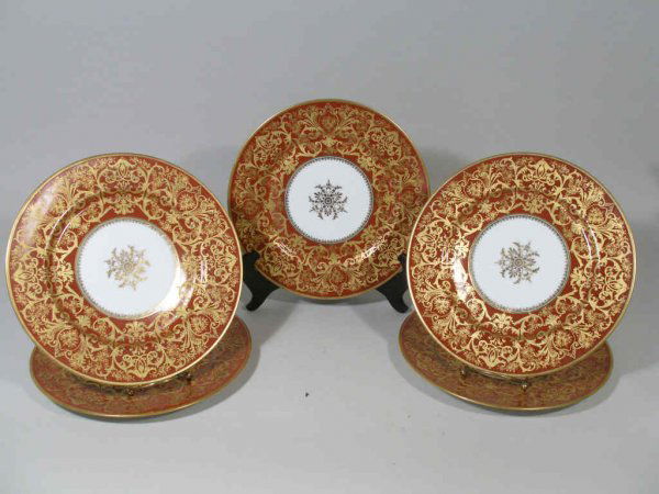 Set of Twelve Bernardaud Limoges Plates,: Set of Twelve Bernardaud Limoges Plates, late 19th c., wide border is a deep Chinese red color w/raised gilt scrolled foliate design and finely worked floral reserves, central medallion in gilt styliz