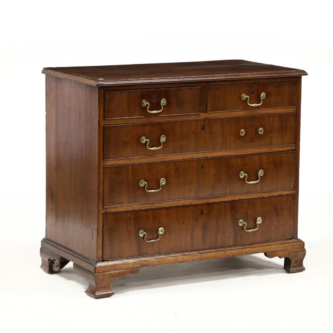 George III Mahogany Bachelor's Chest: George III Mahogany Bachelor's Chest late 18th century, mahogany veneers, pine secondary, top with applied molded edge, two over three graduated cockbeaded drawers, three-quarter dustboards, ogee brac
