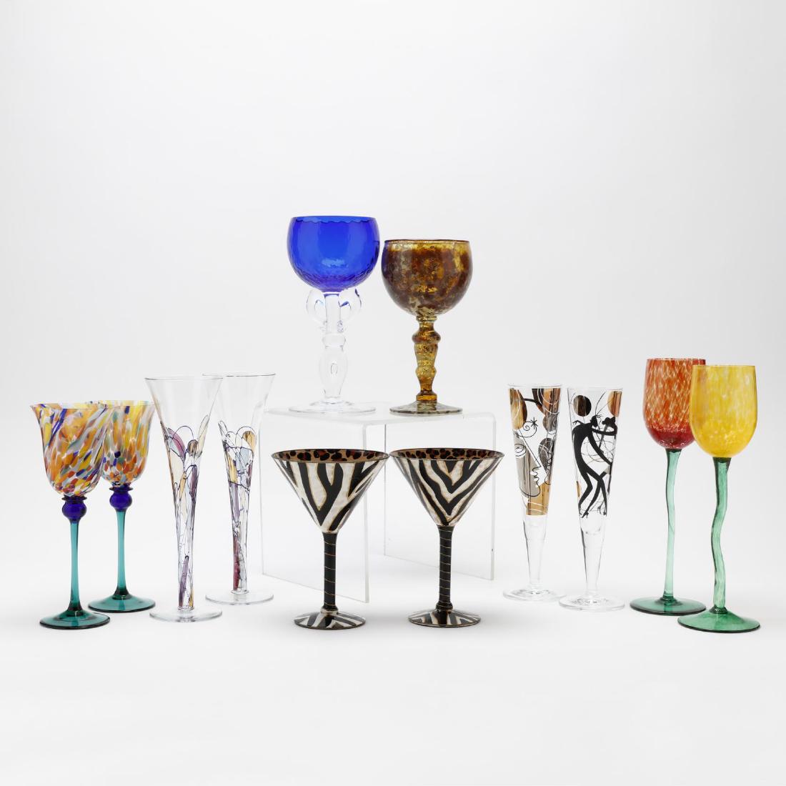Twelve Assorted Art Glass Stems: Twelve Assorted Art Glass Stems late 20th century, including a cobalt stem, a "Red Moss Agate" stem for Neiman Marcus (labeled), a pair of "Cool-Ade" hand painted martinis, a pair of "Helios" champagn