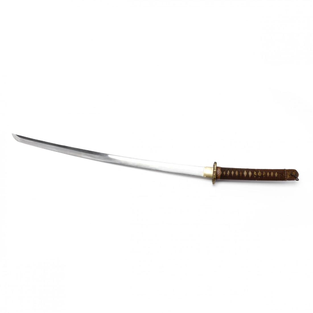 Imperial Japanese Katana: Imperial Japanese Katana 1940s or earlier, the 27 in. blade with tang signed "Kane Sada, chrysanthemum motif throughout, the brass tsuba somewhat crudely cast; the wooden grip wrapped with fabric over