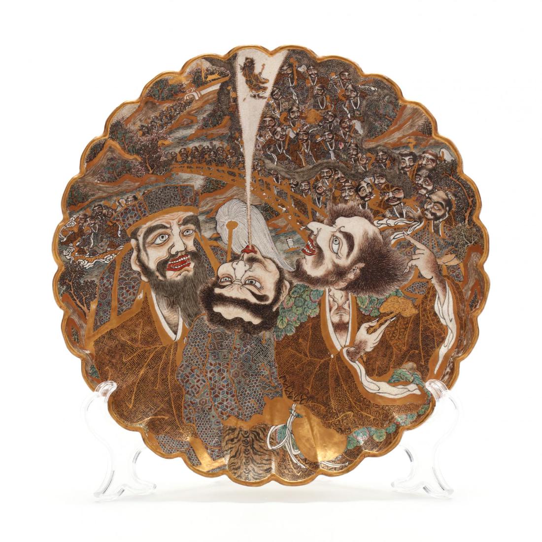 A Japanese Imperial Satsuma Scalloped Dish by Kinkoku: A Japanese Imperial Satsuma Scalloped Dish by Kinkoku Meiji period (1868-1912), signed to underside Dai Nippon Satsuma kuni Kinkoku sei with a satsuma mon and chrysanthemum above, the dish with flared