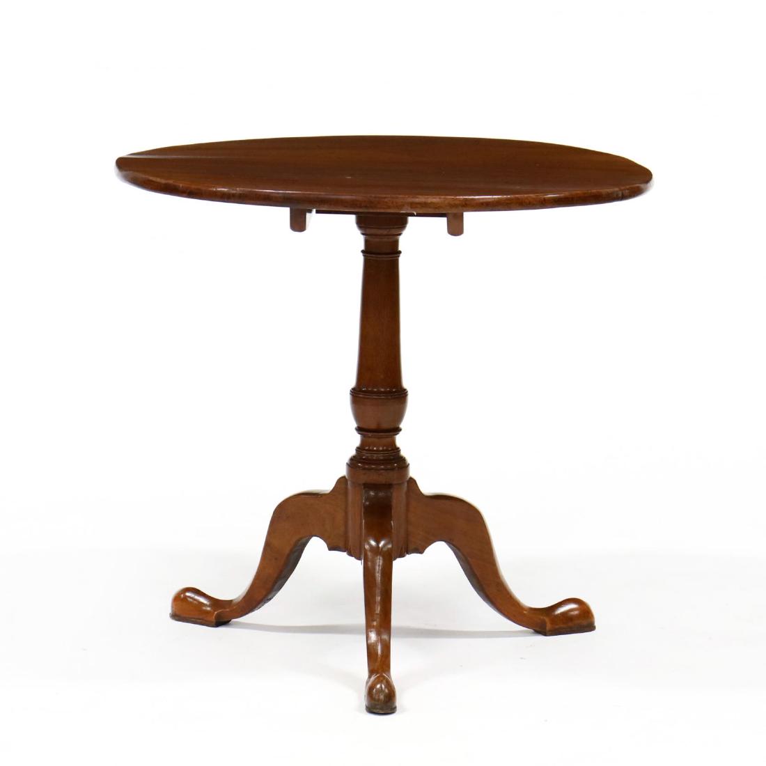 Queen Anne Mahogany Tilt Top Tea Table: Queen Anne Mahogany Tilt Top Tea Table circa 1800, circular top, urn turned standard, on cabriole legs with snake foot with pad. 28 x 30 x 30.5 in. From the Collection of Banks C. and Louise W. Talley