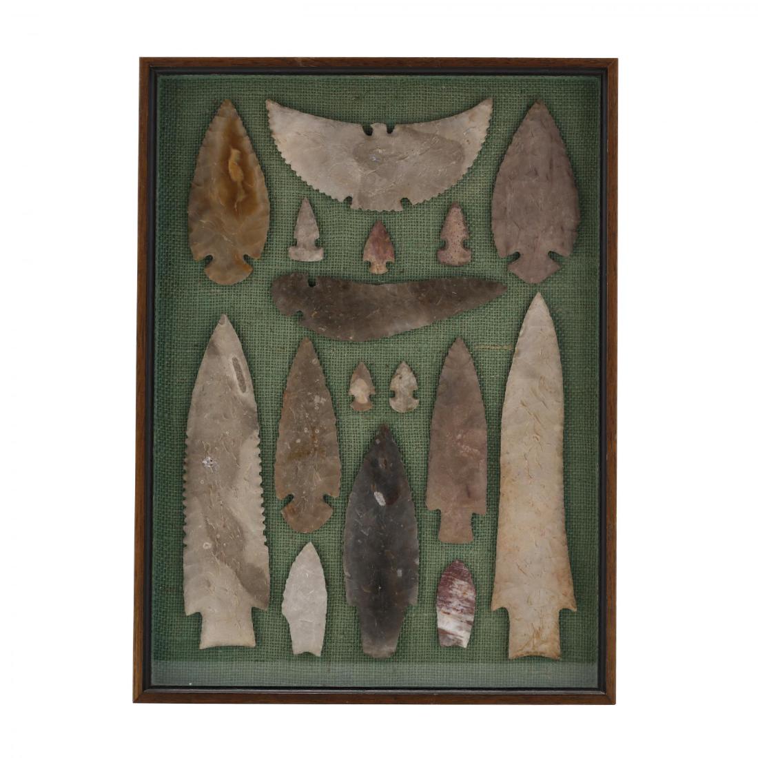 Decorative Shadowbox Frame With 16 Native American: Decorative Shadowbox Frame With 16 Native American Lithics mostly 20th century reproductions of rare Paleo and Archaic material, including an effigy; some of the smaller points possibly authentic. Lar