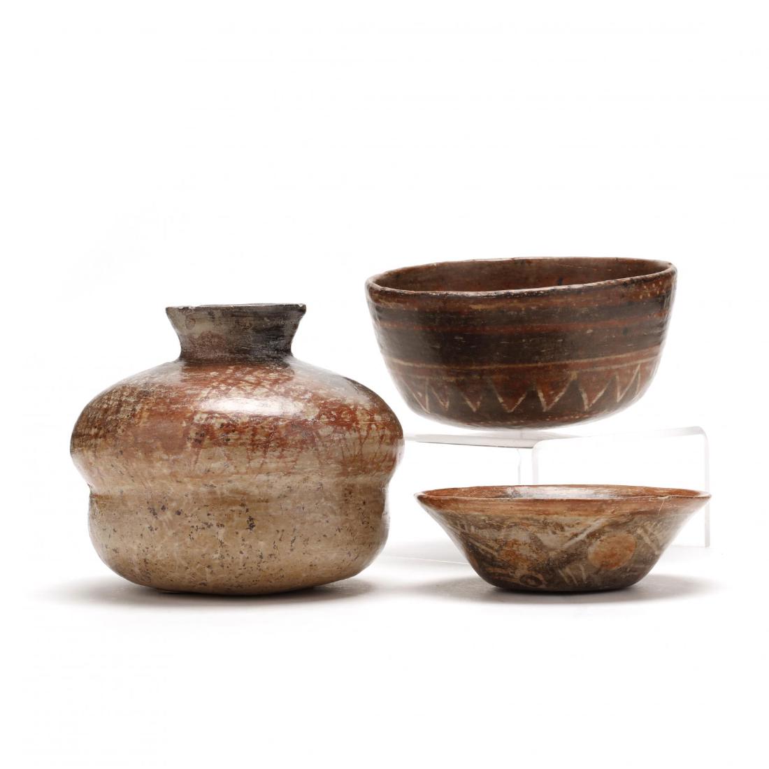 Three Pieces of Early Mexican Geometric Pottery: Three Pieces of Early Mexican Geometric Potterybuff clay with red paint decoration, the first an olla with a card dating it "circa 100-300 A.D." and stating origin as SanIsidro, Jalisco (5 in.) (overa