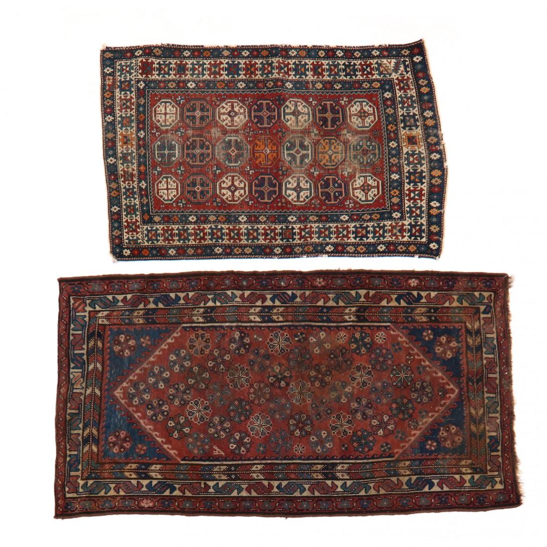 Two Oriental Area Rugs: Two Oriental Area Rugs the first a caucasian red field with repeating octagonal medallions, with guard border, with navy minor border (with wear to foundation and exposed foundation; with repairs, tea
