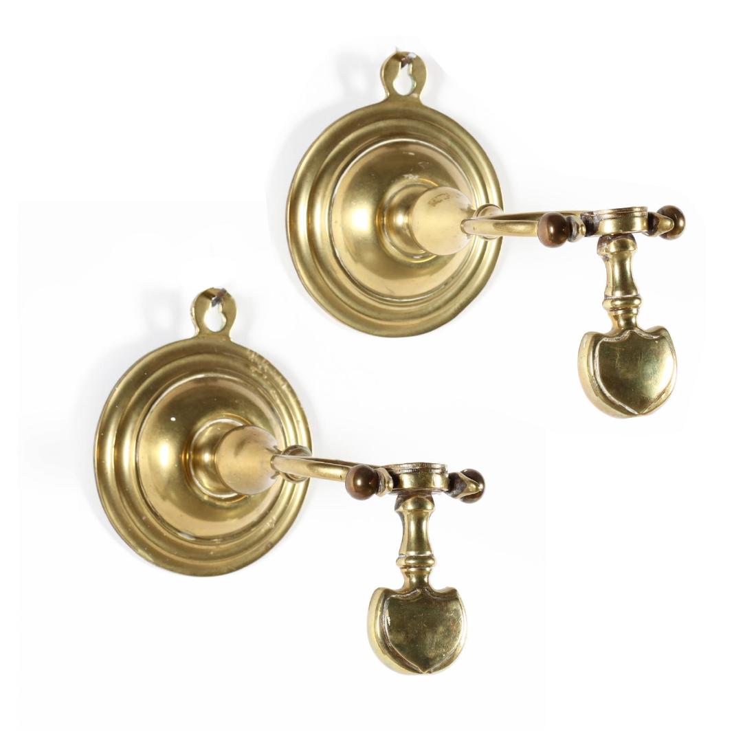 Pair of Antique Brass Ship's Sconces: Pair of Antique Brass Ship's Sconces 19th century, solid cast brass, wall mount form with weighted swing candle cups. 7 x 12 x 5.5 in. The Estate of the late Rushton W. Hays, St. Augustine, FL Additio