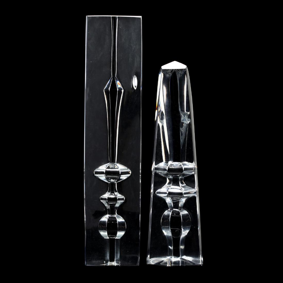Two Baccarat Crystal Obelisks: Two Baccarat Crystal Obelisks France, mid 20th century, each with cut finial patterns, the shorter with partial mark. Taller 10.25 in. The Estate of the late Rushton W. Hays, St. Augustine, FL Additio