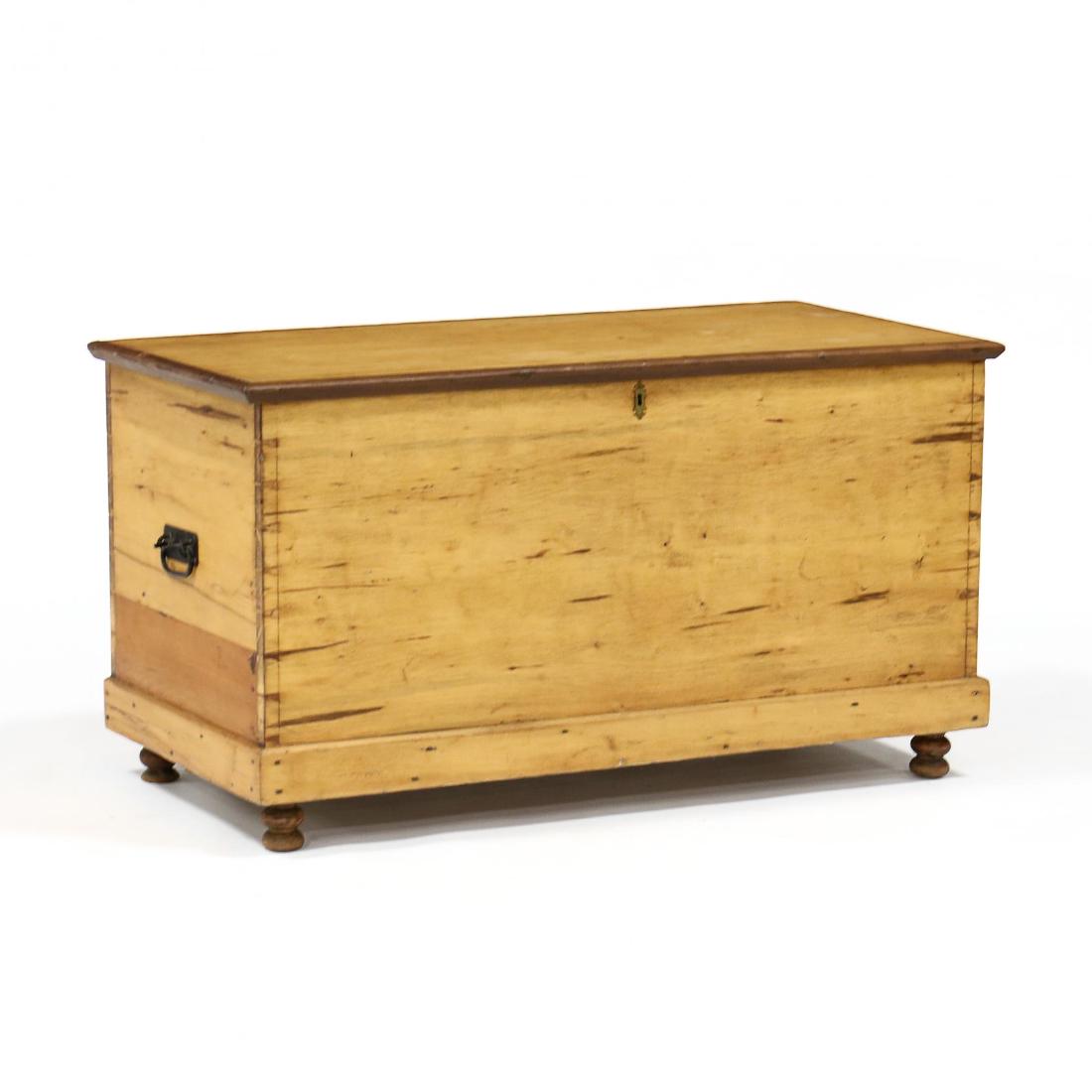 Antique Pine Blanket Chest: Antique Pine Blanket Chest19th century, hinged lid with applied molding, interior with till on left, dovetailed case, molded base, turned feet, iron handles to each side. 24 x 44 x 21.5 in. From the C