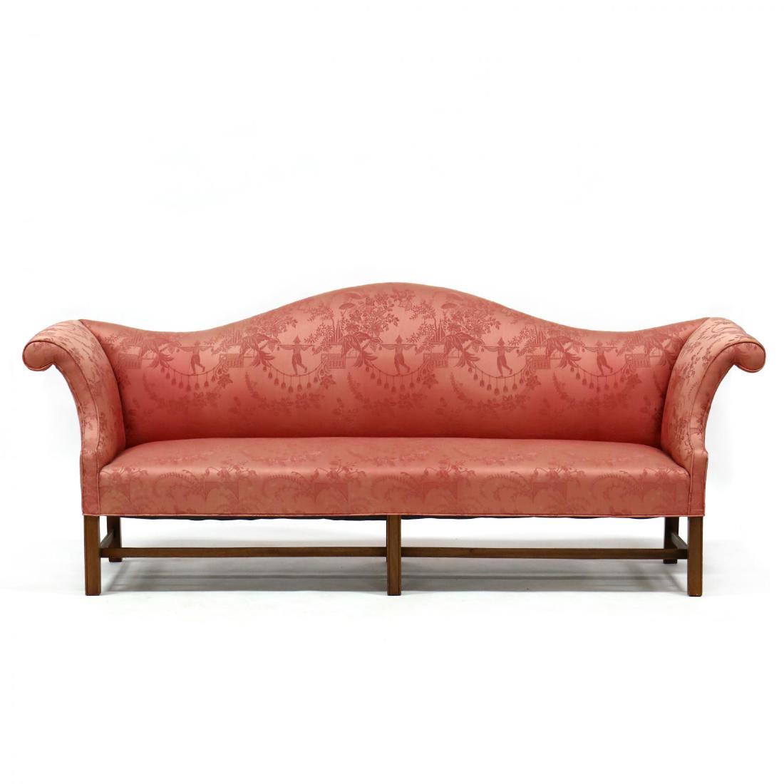 Chippendale Style Camelback Over Upholstered Sofa: Chippendale Style Camelback Over Upholstered Sofaunsigned but of the quality of Kittinger or Baker, 20th century, mahogany, eight foot sofa with scrolled arms, over upholstered seat with silk Chinoise