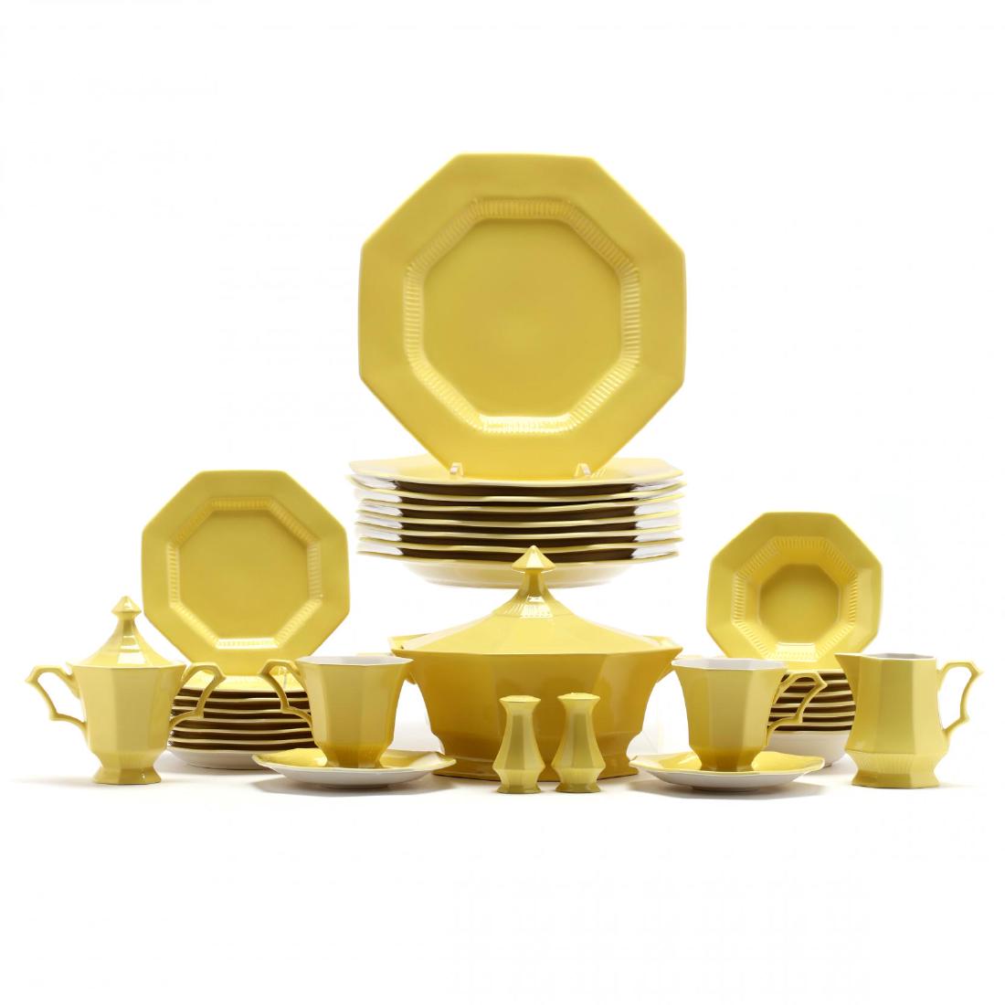 (48) Pieces of Ironstone "Independence" China: (48) Pieces of Ironstone "Independence" China mid 20th century, in a bright yellow glaze, including a pair of shakers, lidded butter dish, three servers, creamer and sugar, tea cups and saucers, dinne