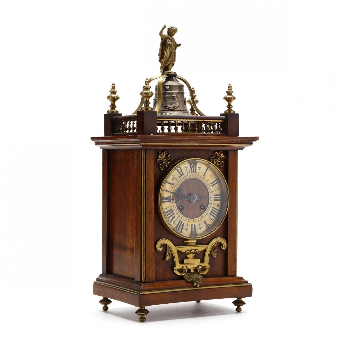 Dutch Style Bracket Clock, Planchon: Dutch Style Bracket Clock, Planchon early 20th century, walnut case with brass face and figural bell strike, marked, with pendulum. 17 x 8 x 5.5 in. From the Collection of Michael Joyce, Greensboro, N