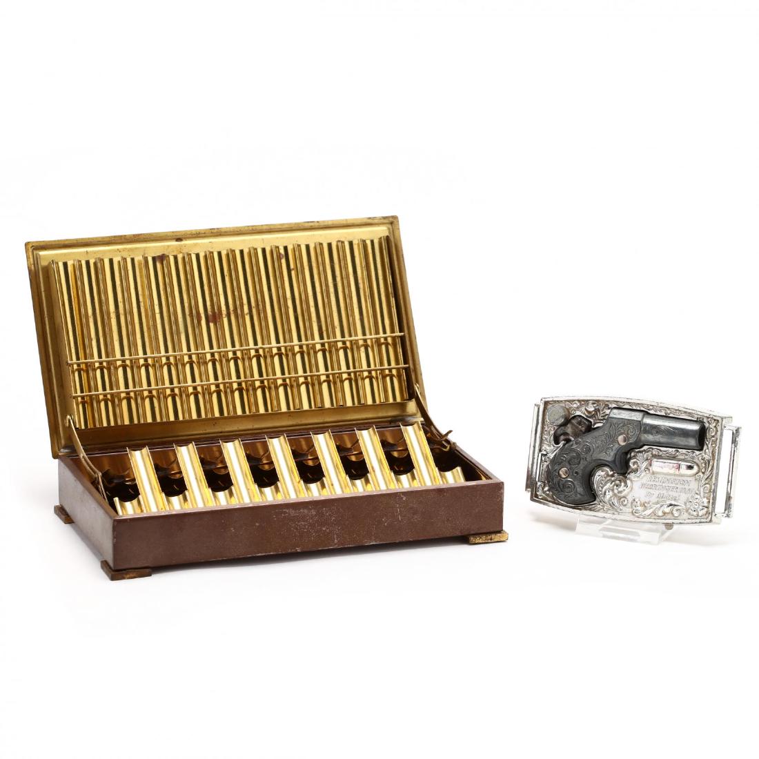 Vintage Cigarette Case and Remington Belt Buckle: Vintage Cigarette Case and Remington Belt Buckle mid 20th century, including a leather and brass cigarette case with fitted interior, marked Park Sherman; together with a Remington Derringer 1867 by M