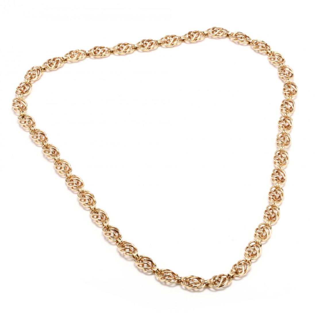 18KT Gold Fancy Link Necklace, German: 18KT Gold Fancy Link Necklace, German the endless necklace comprised of open spiral links, stamped 18K / Germany and NM for Neiman Marcus. 5/8 x 36 in. 79.8 dwt. A Private Collection, Raleigh, North C