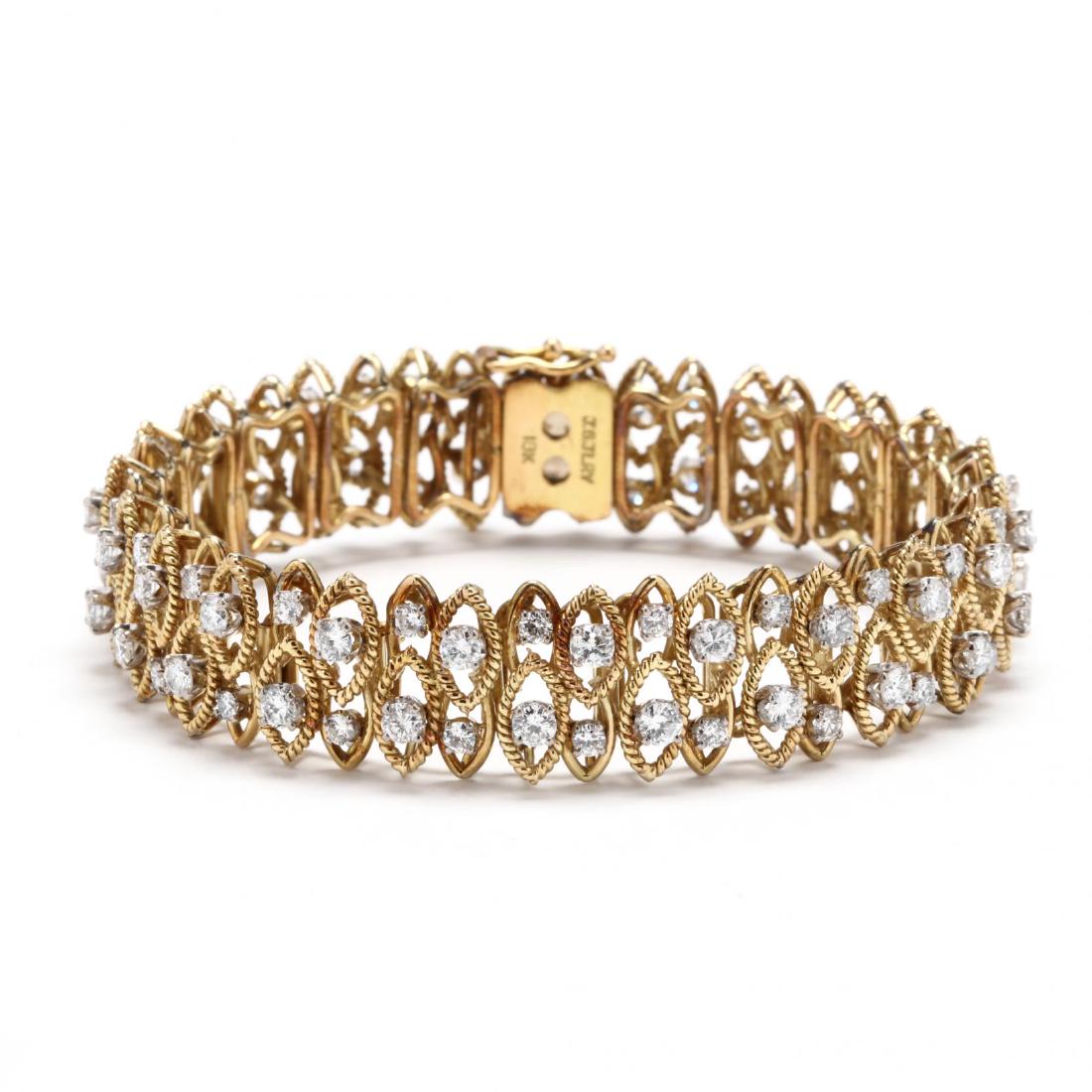 18KT Gold and Diamond Bracelet, Jack Gutschneider: 18KT Gold and Diamond Bracelet, Jack Gutschneiderbracelet comprised of navette shaped links with rope twist detailing, each link prong set with a round brilliant cut diamond, completed with an integra