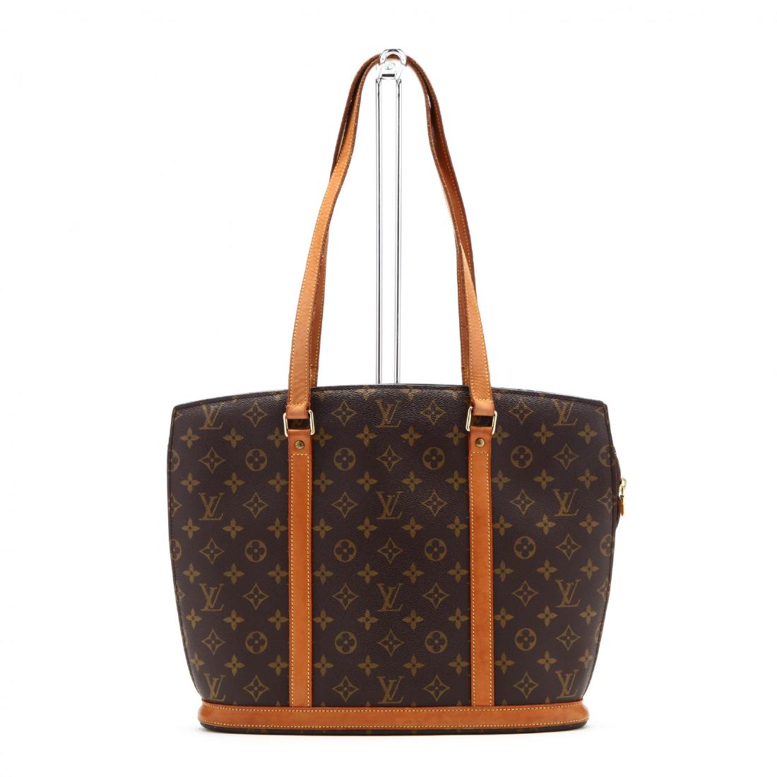 Monogram Canvas Tote, Babylone , Louis Vuitton: Monogram Canvas Tote, Babylone, Louis Vuitton made in France, a roomy bag with cowhide trim, a flat base, gusseted sides, the long strap handles are comfortable for shoulder carry, beige Alcantara lin
