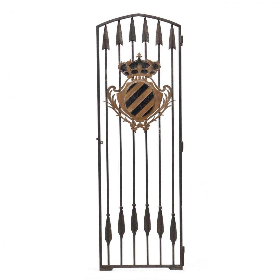 Continental Antique Iron Gate with Coat of Arms: Continental Antique Iron Gate with Coat of Arms 19th century, tall vertical arched form with six pointed spears and applied painted metal coat-of-arms with crown, single sided. 84 x 28 in. Given it's 