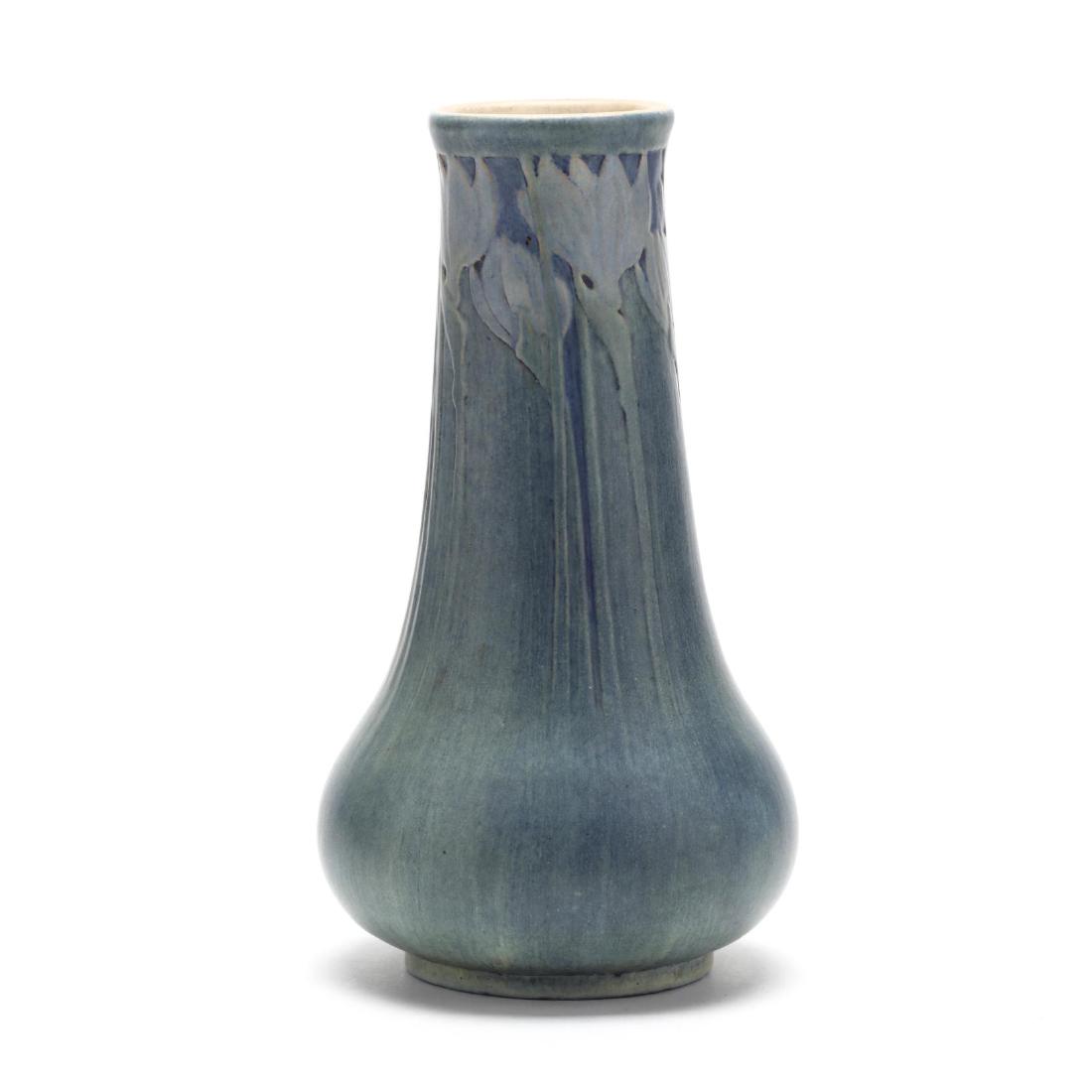 Newcomb College Art Pottery Vase: Newcomb College Art Pottery Vase date mark for 1914, decorator cipher for Henrietta Bailey (1874-1950), matte blue glaze relief carved with long stemmed budding tulips. 9 x 4.75 in. Estate of the Late