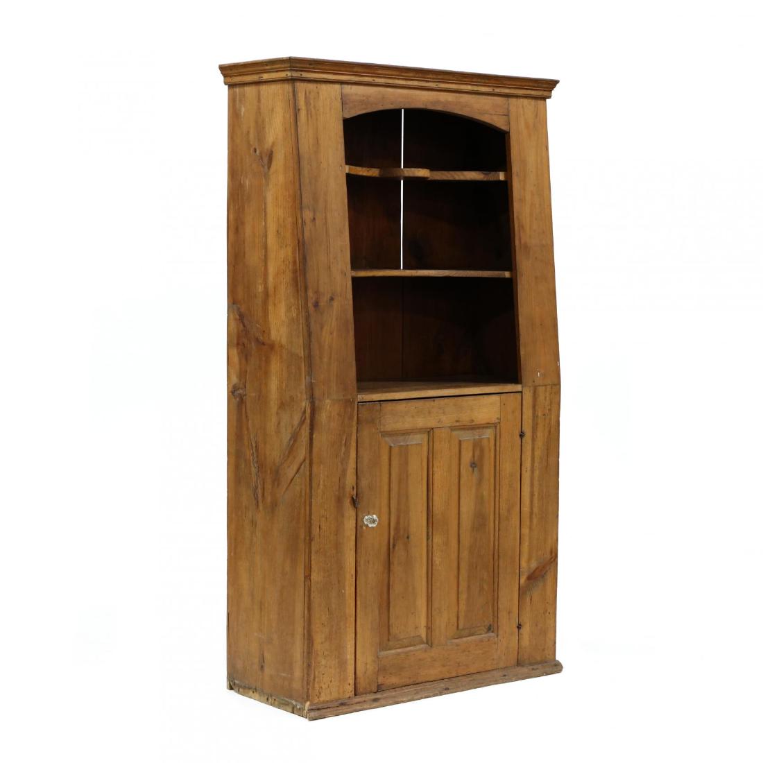 Antique New England Pine Flat Wall Cupboard: Antique New England Pine Flat Wall Cupboard circa 1800, one-part tapered form, applied molded cornice, upper open cabinet with butterfly shelves, upper hinged raised panel door with shelved interior, 