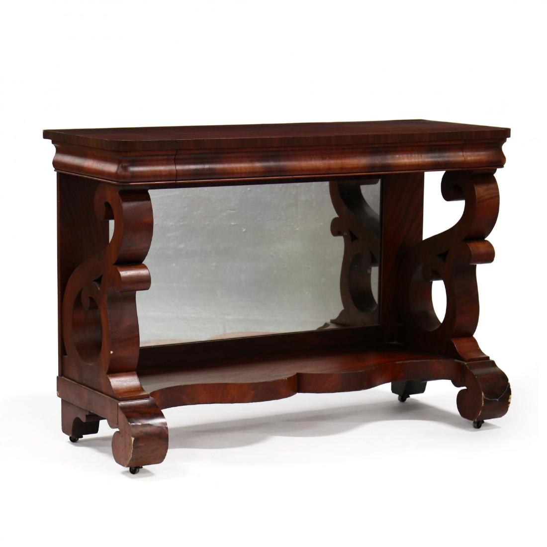 Berkey & Gay, American Classical Style Mirrored Pier: Berkey & Gay, American Classical Style Mirrored Pier Tableearly 20th century, mahogany, ogee flush drawer, mirrored back, lower shaped shelf, bold scrolled supports and feet, on casters, labeled. 37.5