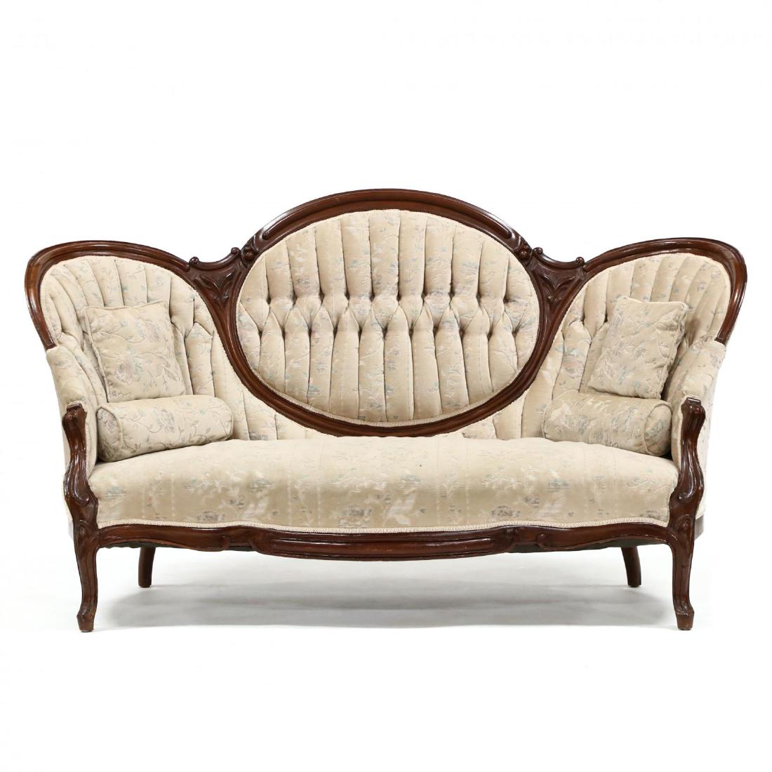 A Victorian Medallion Back Settee: A Victorian Medallion Back Settee molded and carved walnut frame, chenille upholstery with tufted back, circa 1870. 41.5 x 75 x 32 in. Additional high-resolution photos are available at LelandLittle.c