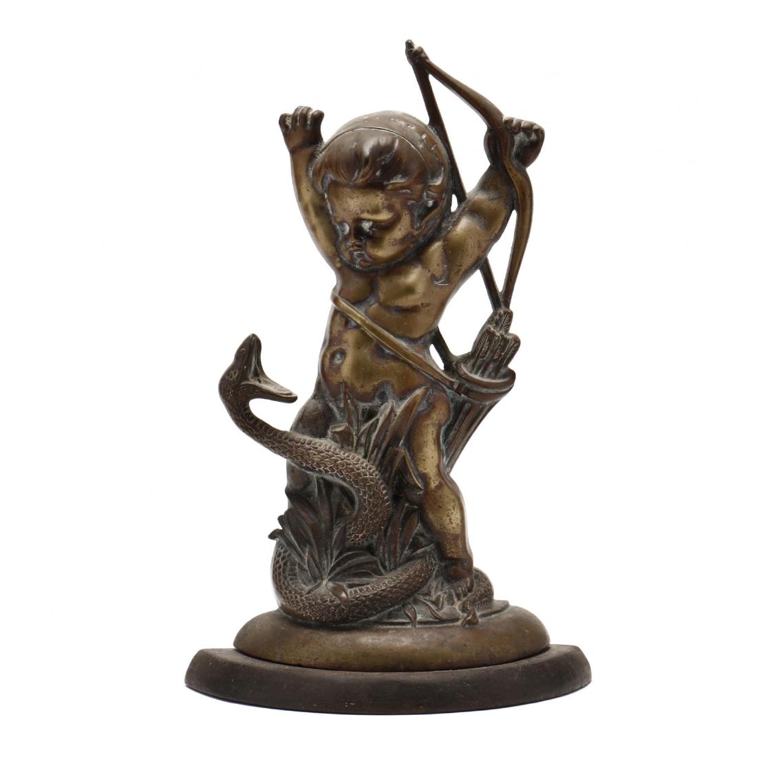 A 19th Century English Brass Doorstop: A 19th Century English Brass Doorstop with registry number 330051 dating the design to 1885, depicting Cupid (or Eros) battling a serpent, with original lead weight. 16 in. From the estate of the late