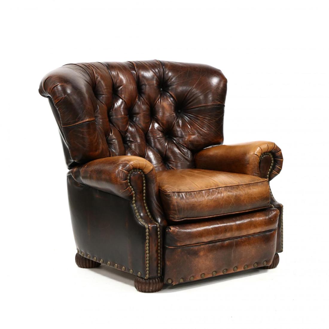 Bradington Young, English Style Tufted Leather Recliner: Bradington Young, English Style Tufted Leather Recliner late 20th century, rich brown leather with brass nail head trim, loose cushion, leaning back operates the pop out foot rest, on reeded bun feet,