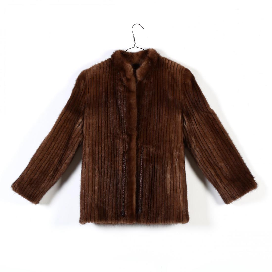 Ladies Vintage Mink Jacket: Ladies Vintage Mink Jacketcomposed of chestnut colored furs constructed with vertical ribbing, mandarin collar, hook and braided tie closure, fully lined, "Avanti / Thalhimers" label and "Saga Mink".