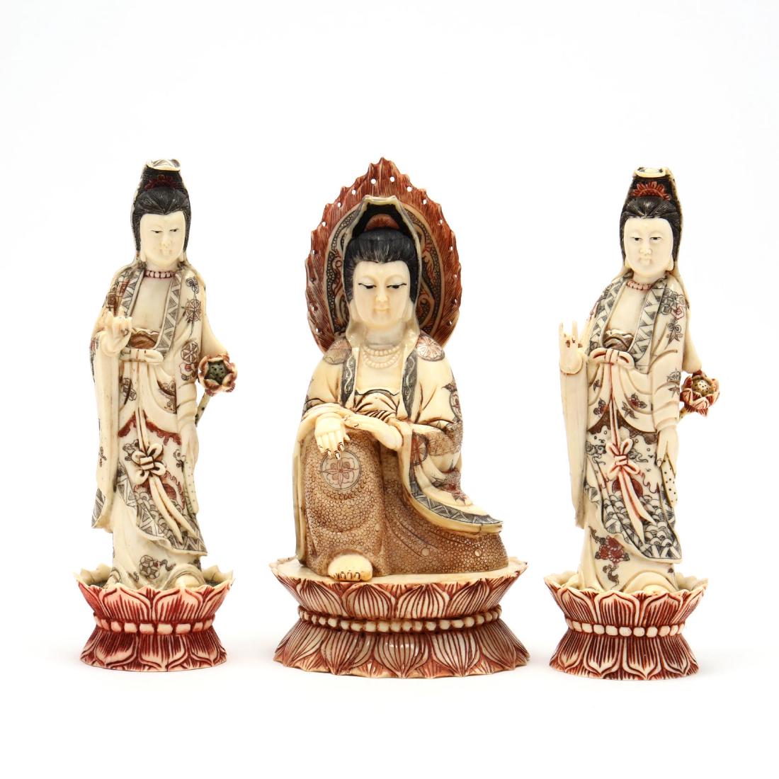 Three Carved and Painted Bone Buddhist Sculptures: Three Carved and Painted Bone Buddhist Sculptures mid to late 20th century, carved and painted with two standing figures and one seated, each on a lotus blossom plinth. Tallest 9.25 in. Additional hig
