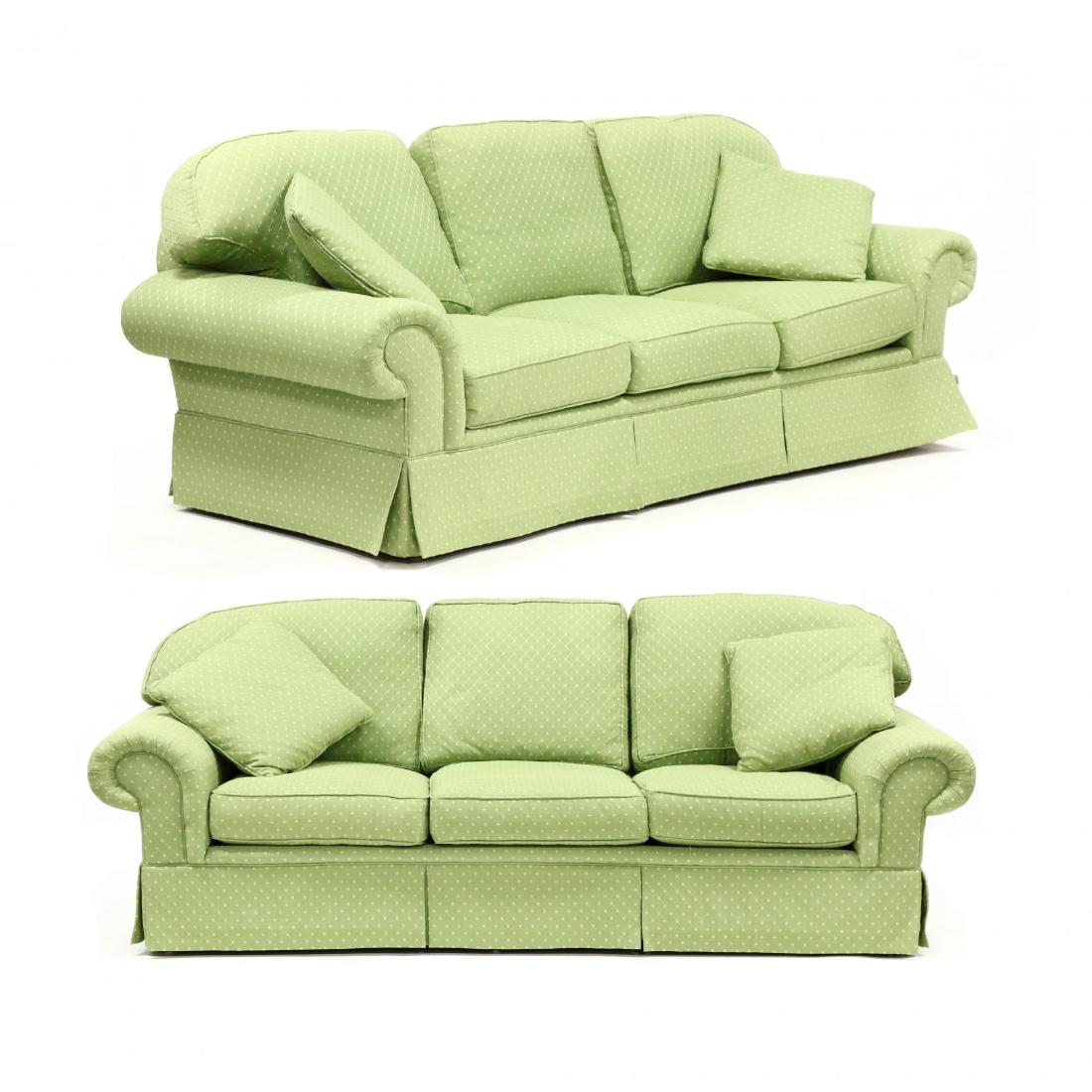 Michael Thomas, Pair of Custom Upholstered Sofas: Michael Thomas, Pair of Custom Upholstered Sofas contemporary, green embroidered upholstery with golden diamond pattern, with loose down filled cushions and pillows, paneled skirt on short wood feet, 
