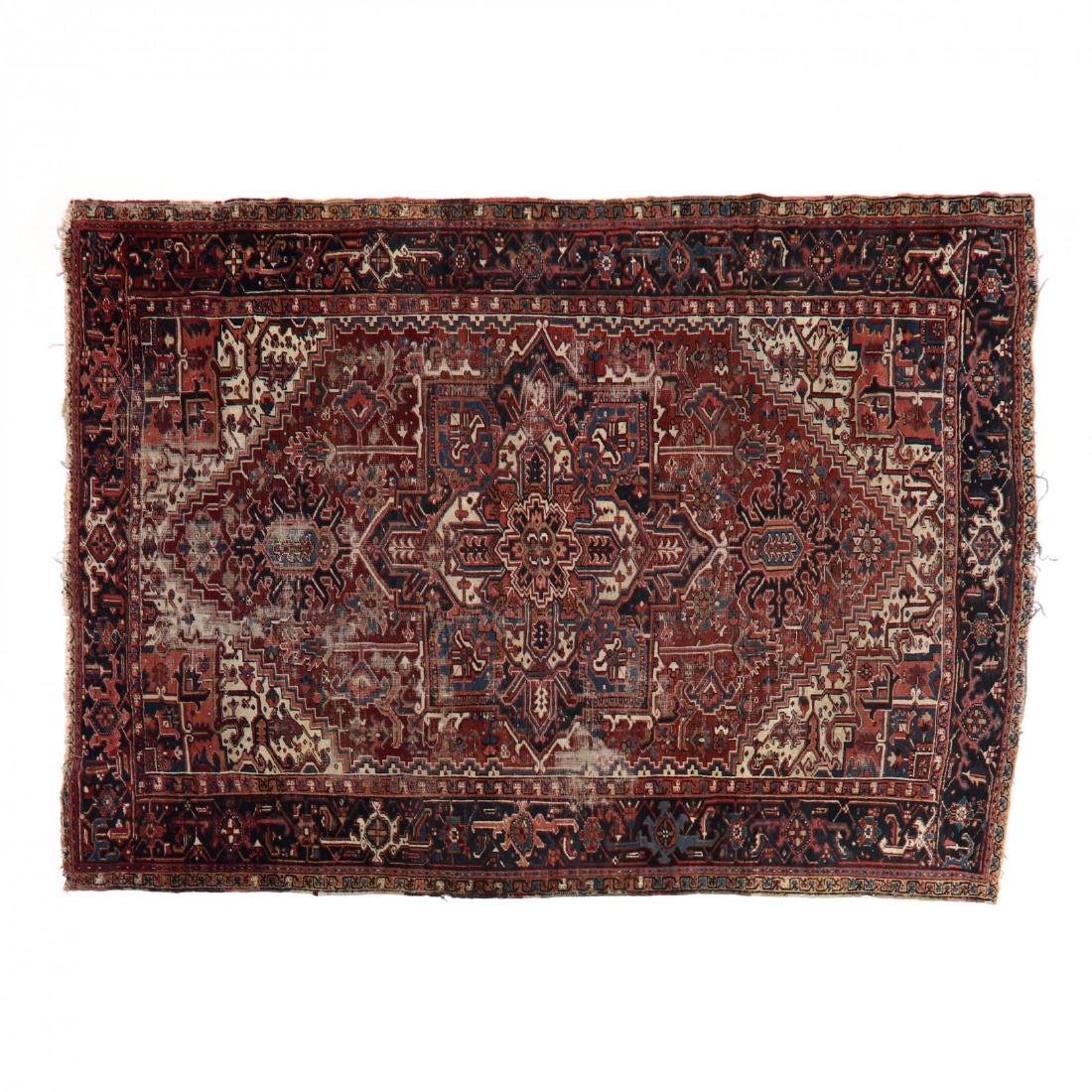 Heriz Rug: Heriz Rug center medallion on red field with design elements, with midnight blue guard border. 9 ft. 2 in. x 12 ft. 7 in. From the Estate of the Late Eleanor Kennedy, Raleigh, North Carolina Additiona