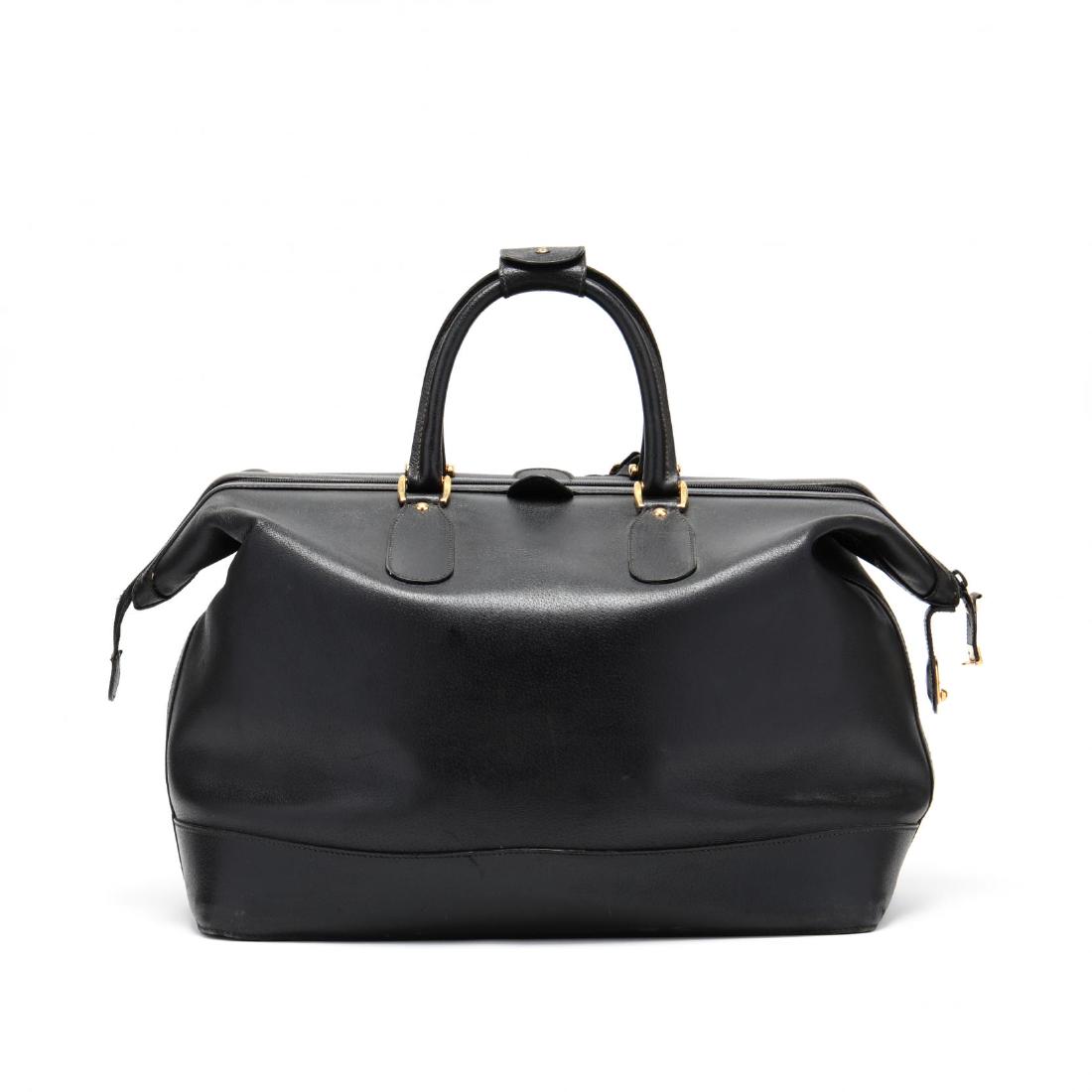 Vintage Gucci Weekender: Vintage Gucci Weekendera spacious black saddle leather travel bag, rolled handles, locking zipper top, fabric interior with one zipper pocket, leather tag with Gucci imprint 012-123-3467-50 blind stam