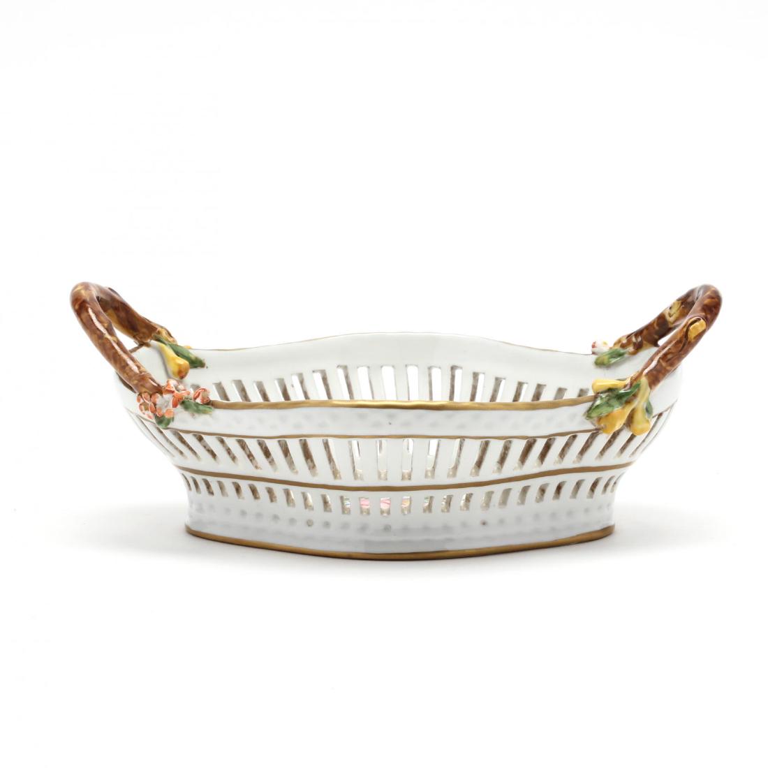 Sevres Style Porcelain Fruit Basket: Sevres Style Porcelain Fruit Basket 20th century, reticulated with branch form handles. 4 x 9.5 in. From the Estate of the Late Eleanor Kennedy, Raleigh, North Carolina Additional high-resolution phot