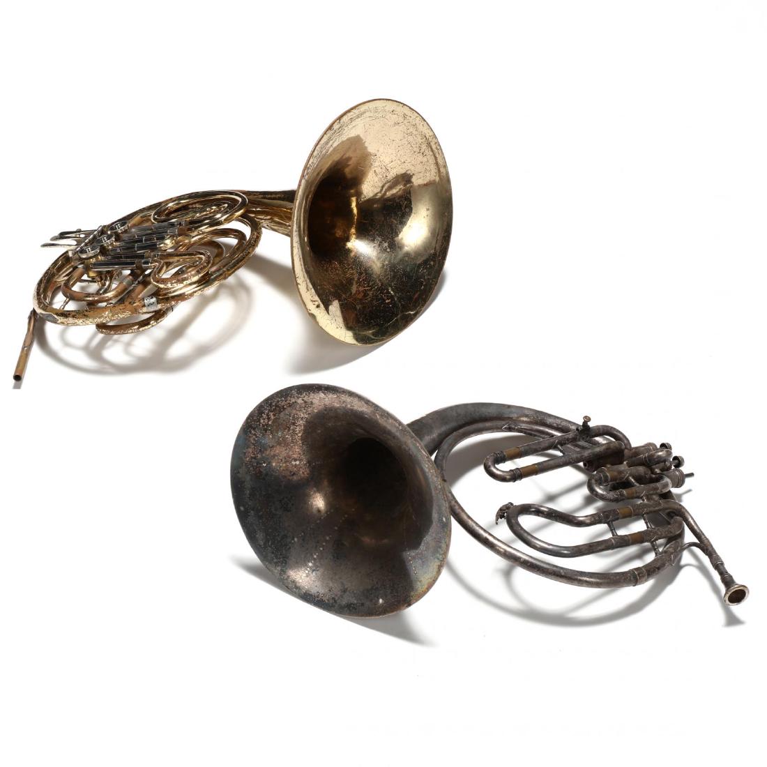 Two Vintage French Horns: Two Vintage French Horns to include a brass Yamaha YHR311, 1970s, in case (lacking mouthpiece; with heavy scratching and wear; dents); and a Cleveland Musical Instrument Co. silverplate horn, G30014, 