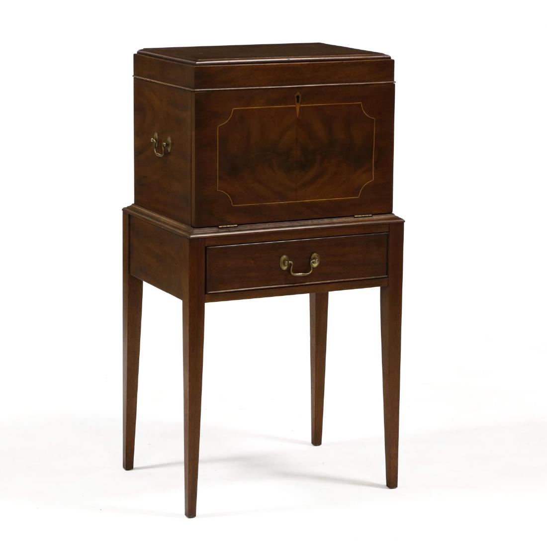 Henkel Harris Inlaid Mahogany Cellaret: Henkel Harris Inlaid Mahogany Cellaretlabeled, second half of the 20th century, hinged lid, interior with eight bottle divider, fall front with drinks server, single cockbeaded drawer, tall square tap