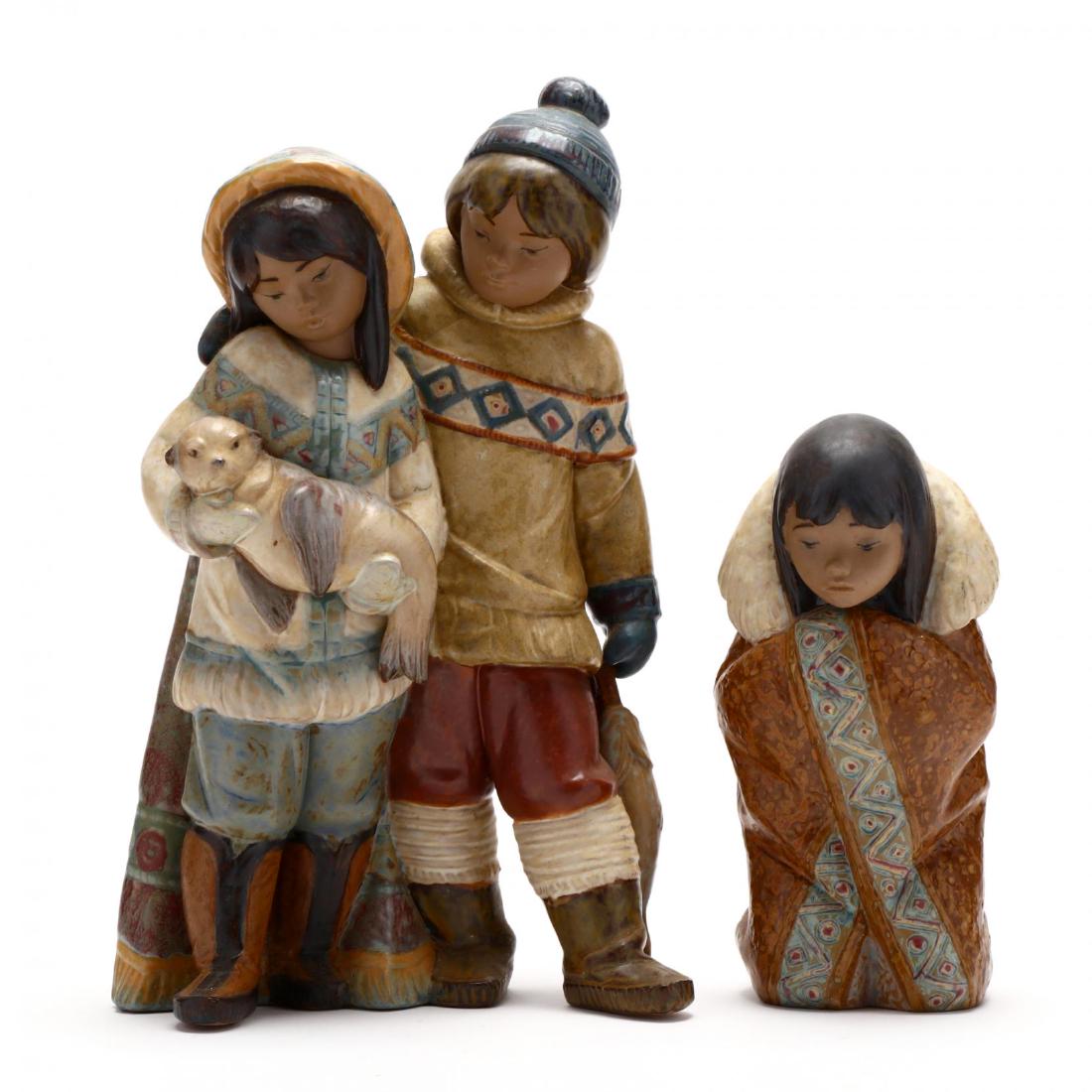 Two Lladro Inuit Figurines: Two Lladro Inuit Figurinesincluding a 1984 retired #2156 "Arctic Winter Kneeling Eskimo Girl" in gres matte glazes; and a 1991 #2227 "Arctic Allies Couple Eskimo Boy Girl Seal" in gres matte glazes, b