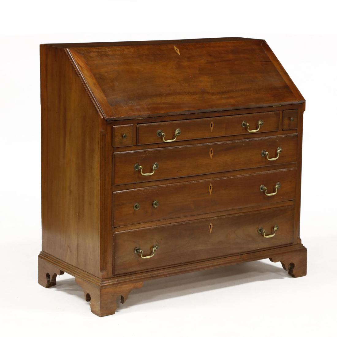 North Carolina Chippendale Walnut Slant Front Desk: North Carolina Chippendale Walnut Slant Front Desk late 18th century, Rowan County, attributed to the Gheen School, yellow pine secondary, dovetailed case, lipped slant lid with candle drawer loper su