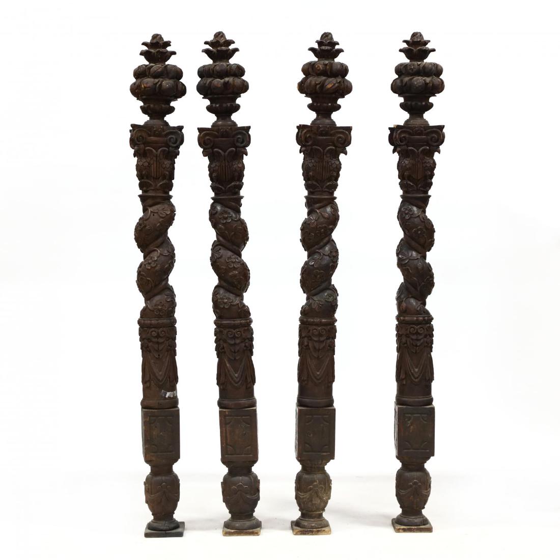 Set of Four Antique Italian Solomonic Posts: Set of Four Antique Italian Solomonic Posts18th century, oak, with fruit basket finials, carved eagle supports, spiral twist column with floral relief carving, over swags, on a carved urn foot. 73 x 7