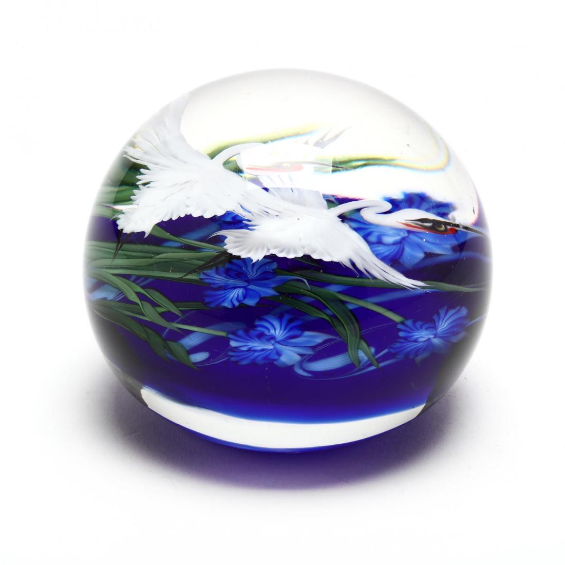 Lundberg Studios, Double Crane Paperweight: Lundberg Studios, Double Crane Paperweight 2014, created by Daniel Salazar, flame worked with double cranes over blue flowers, signed and numbered 070910. 2.75 in.
