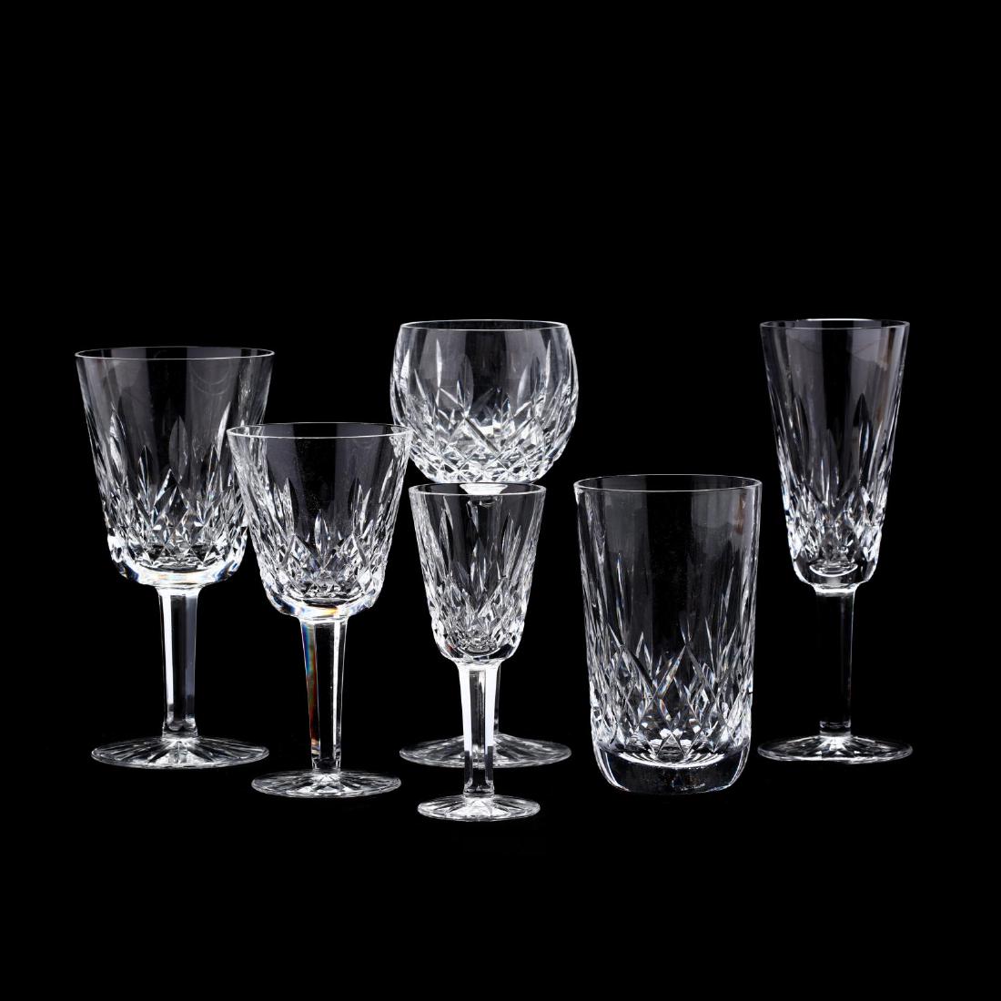 A Suite of Waterford "Lismore" Crystal Stemware: A Suite of Waterford "Lismore" Crystal Stemware (27) pieces including: (7) water goblets; (4) champagne flutes; (7) claret wines; (6) wine hocks; (2) sherry glasses; and a 12 oz. tumbler. Marked.