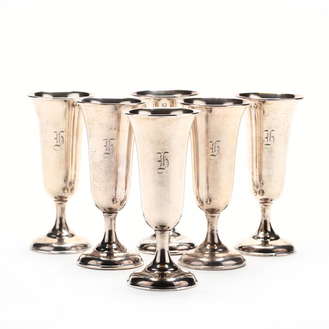 A Set of Six Sterling Silver Goblets: A Set of Six Sterling Silver Goblets parcel gilt, unidentified manufacturer, weighted base, each with period "H" monogram. 6 1/8 in.