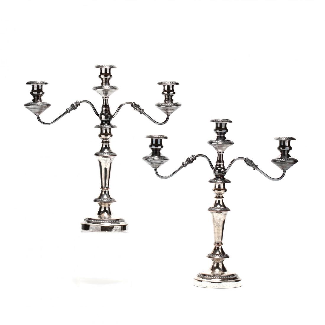 A Pair of Vintage Silverplate Candelabra: A Pair of Vintage Silverplate Candelabra in the Georgian style, three-light convertible form, silver over copper, with original candle nozzles. 19.5 x 18 in.