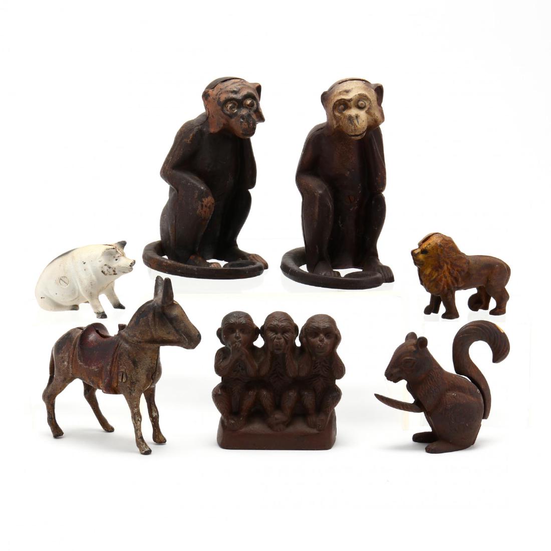 Group of Vintage Cast Iron Figural Still Banks: Group of Vintage Cast Iron Figural Still Banksincluding three monkeys, one pig, one mule, one lion and one squirrel nut cracker. Tallest 7.75 in. Collection of Edith Womble Chatham, Pinehurst, North C