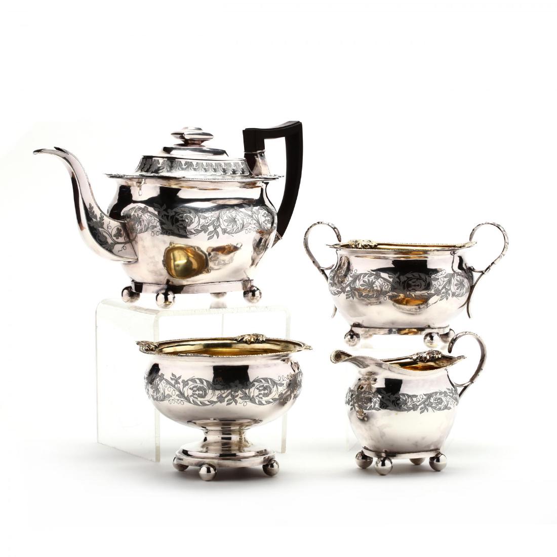 A New York Federal Period Coin Silver Tea Set: A New York Federal Period Coin Silver Tea Setmark of Hugh Wishart (active circa 1793-1824), the four piece service including a teapot with ebonized handle (7 3/8 in.), a parcel gilt sugar bowl, parcel