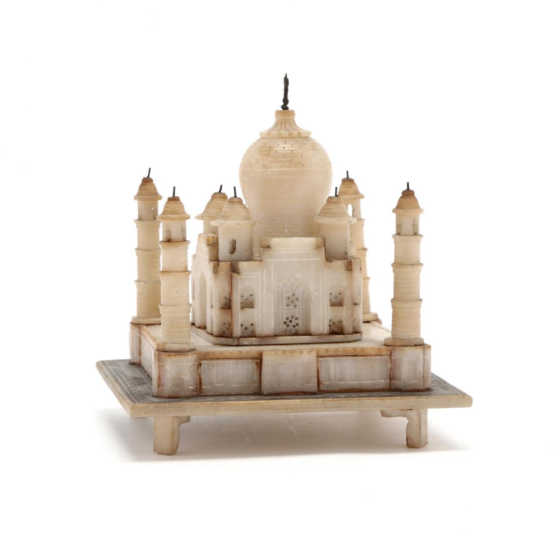 A Model of the Taj Mahal: A Model of the Taj MahalIndia, 20th century, a three-part finely detailed diminutive scale representation of the Taj Mahal made from possibly alabaster. 6.5 x 6 x 6 in. Additional high-resolution pho