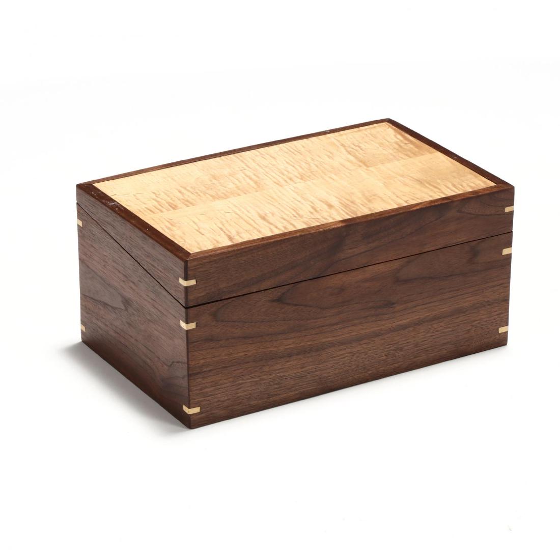 Contemporary Bench Made Storage Box: Contemporary Bench Made Storage Box late 20th century, maple and walnut, mortised corners, hinged slant cut lid with open interior, appears unsigned. 9 x 18 x 11 in. Private North Carolina Collection 