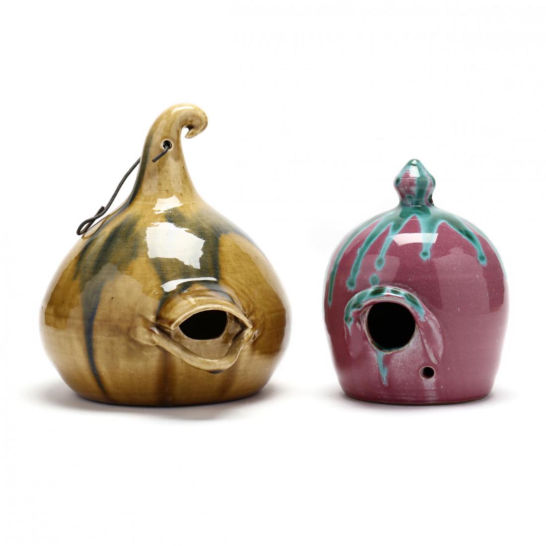 Two Contemporary Art Pottery Bird Houses: Two Contemporary Art Pottery Bird Houses a signed "Foster" piece with Auman style glaze (9 x 6.5 in.)' a house signed "JB 1995" (7.5 in.). From the Collection of Mary Wells, Greensboro, North Carolina