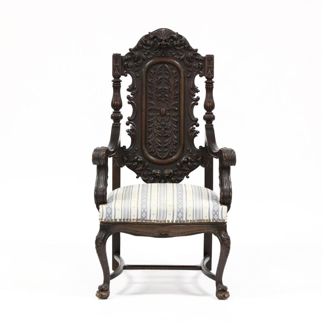 Antique Continental Carved Oak Hall Chair: Antique Continental Carved Oak Hall Chair late 19th century, relief carved back with mask and acanthus leaf design, blue/white striped upholstered seat with brass nail head trim raised on carved paw f