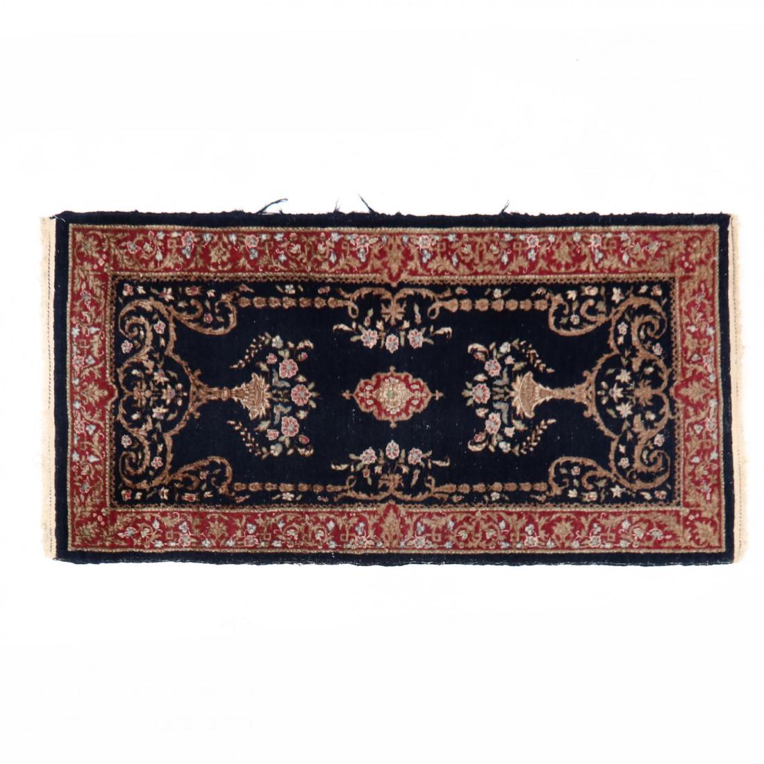 Kerman Area Rug: Kerman Area Rug blue field with floral design elements, with red guard border. 2 ft. x 4 ft. Additional high-resolution photos are available at LelandLittle.com