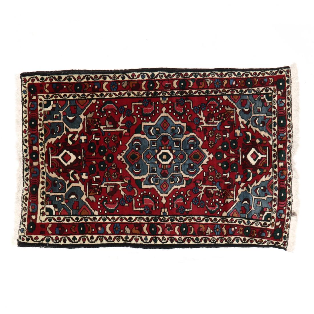 Hamadan Area Rug: Hamadan Area Rug red field with center blue medallion and field with floral and rosette design elements. 3 ft. 3 in. x 5 ft. Private North Carolina Collection Additional high-resolution photos are ava