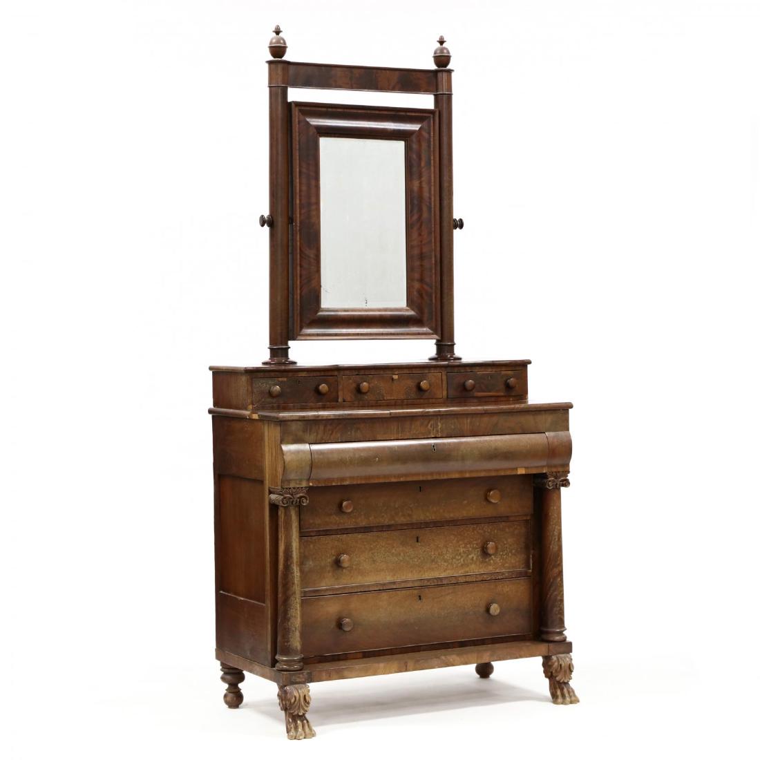 American Classical Mahogany Dresser: American Classical Mahogany Dresser Mid-Atlantic, circa 1820-30, mahogany, mahogany veneer, poplar, yellow pine, and white pine secondary, rectangular ogee hinged beveled dressing mirror, within a col
